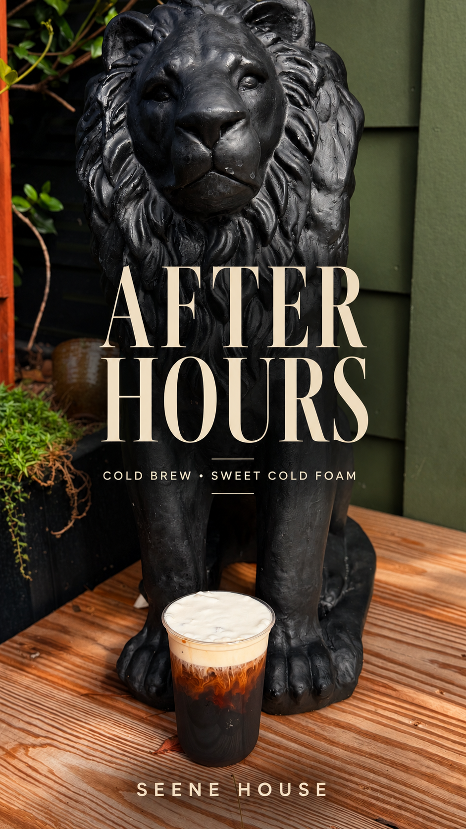 After Hours cold brew with sweet cold foam beside the black lion statue at Seene House